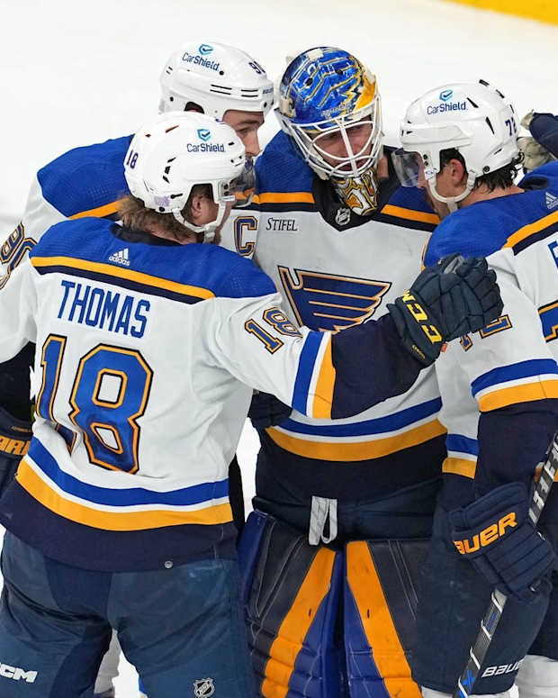 Nov 12, 2022; Las Vegas, Nevada, USA; St. Louis Blues goaltender Jordan Binnington (50) celebrates with St. Louis Blues center Ryan O'Reilly (90), St. Louis Blues center Robert Thomas (18), and St. Louis Blues defenseman Justin Faulk (72) after defeating the Vegas Golden Knights 3-2 at T-Mobile Arena. Mandatory Credit: Stephen R. Sylvanie-USA TODAY Sports